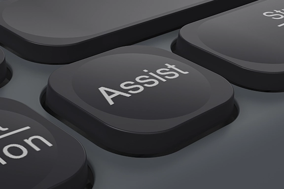 Detailed view of the buttons, the focus is on the ‘Assist’ button, which activates the cross-programme AI assistant.